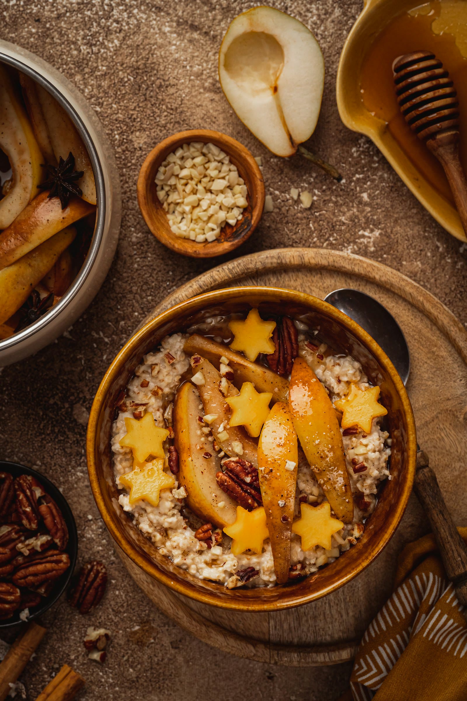 Warm bowl of porridge with pear slices and cinnamon