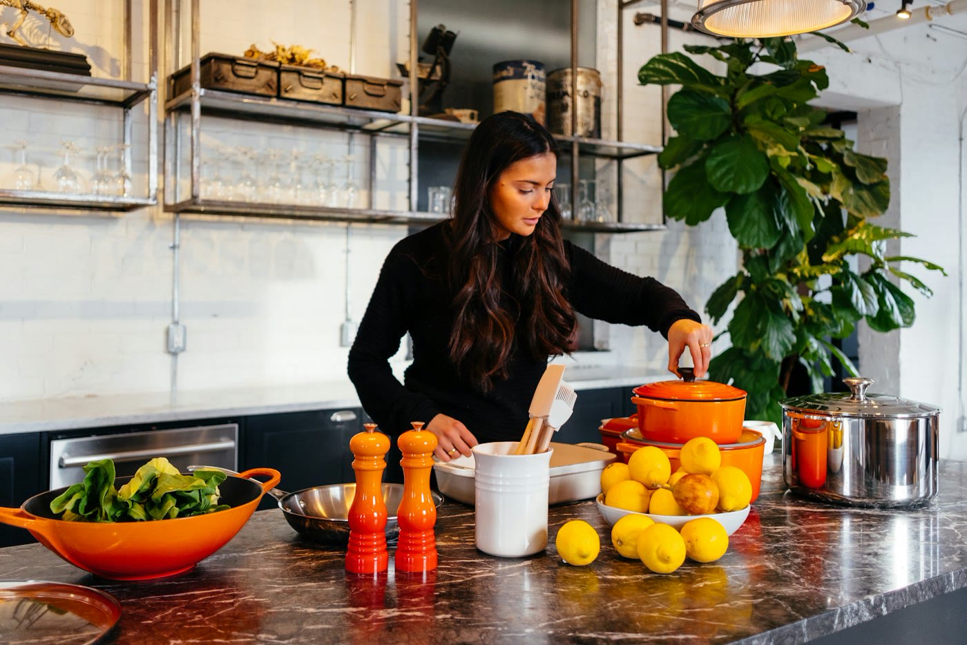 Two people preparing a meal together in a home kitchen